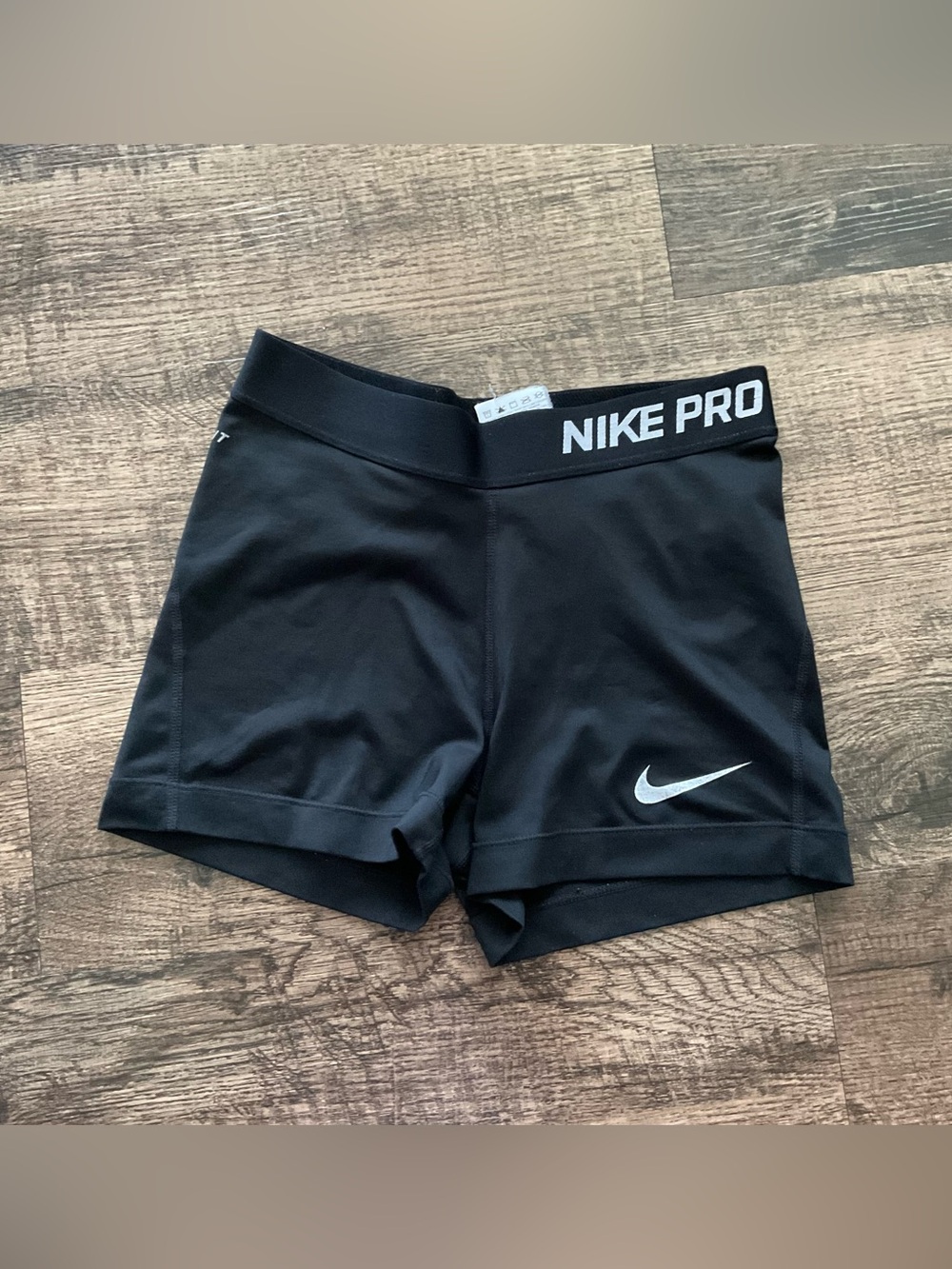 Nike Pro Women's Black Athletic Compression Shorts with White Swoosh